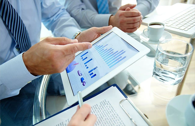 Business professional reviewing financial and compliance documents during a company annual review in Singapore