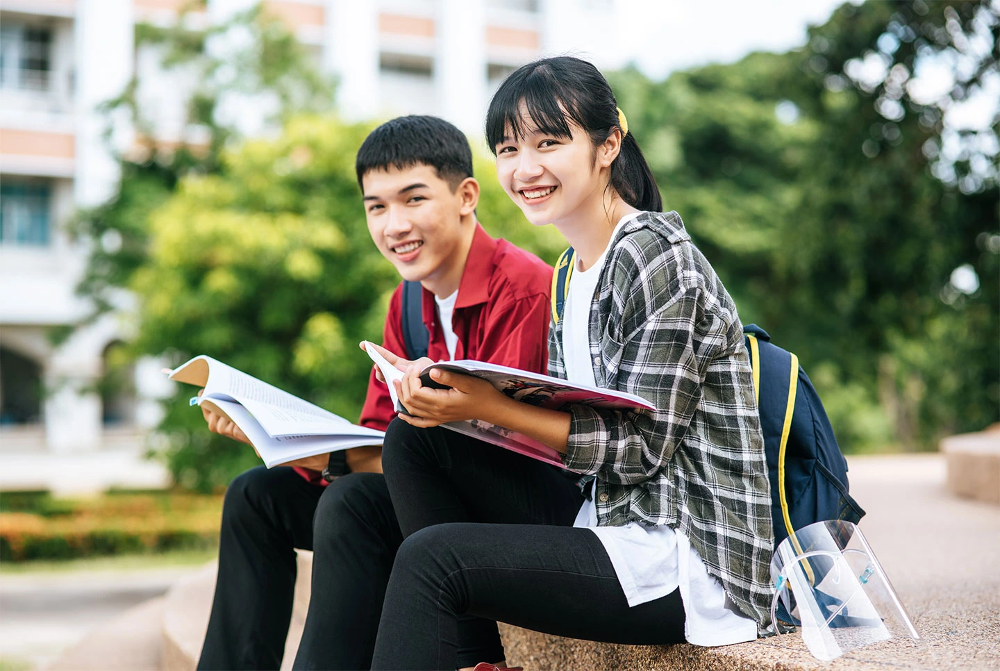 Two international students arriving in Singapore with their student visas to begin their studies.