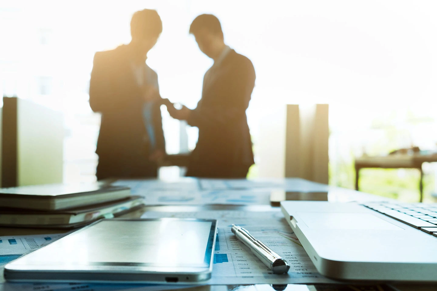 Team partners collaborating in an office setting for Singapore Employment Pass application.
