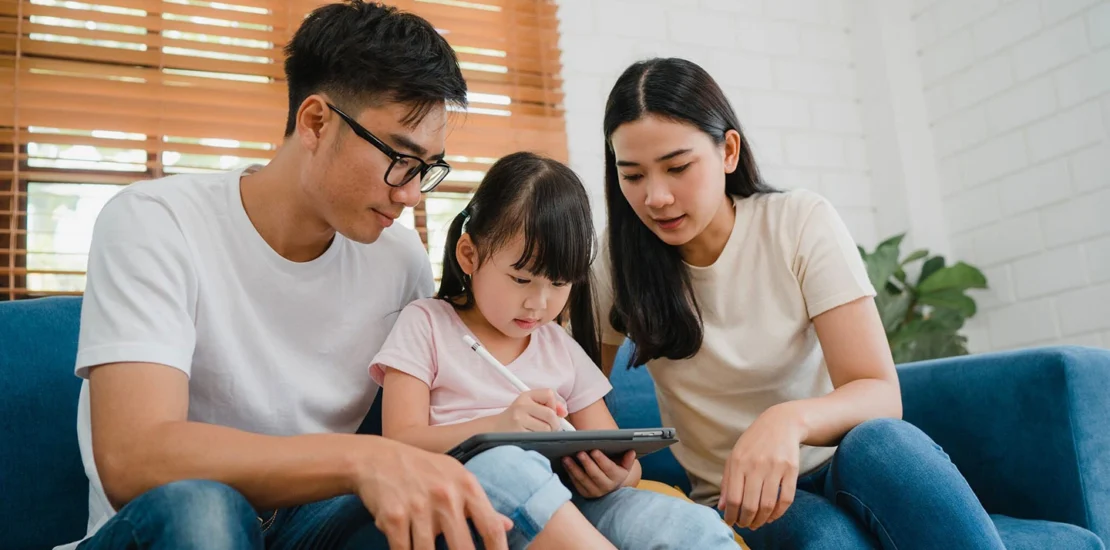 Family with children happily relocating to Singapore on a Dependent Pass.