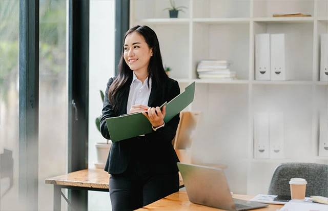 Professional reviewing company documents and compliance records, representing Yobbi’s corporate secretary services in Singapore