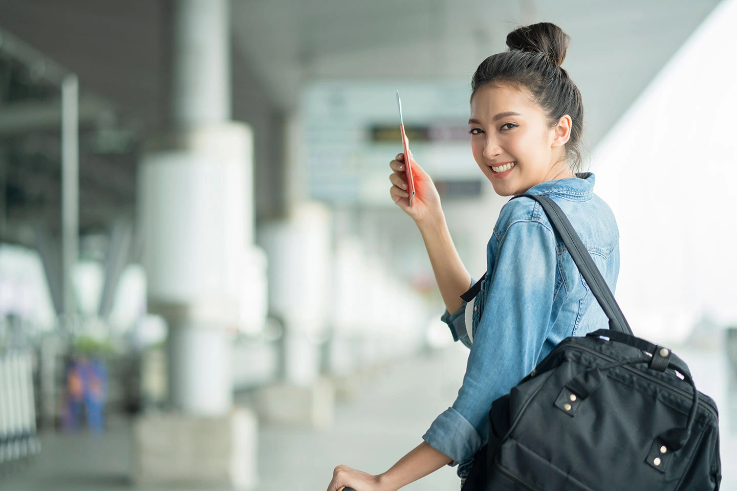 Young woman ready to begin a new life abroad after securing visa and permanent residency.