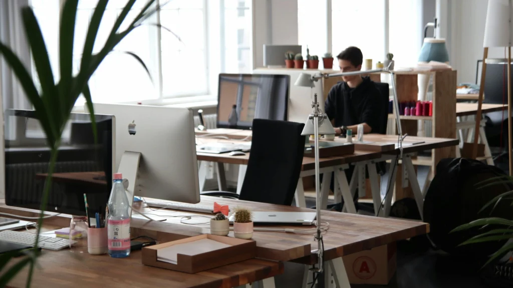 Employees reviewing workplace policies in an office setting.